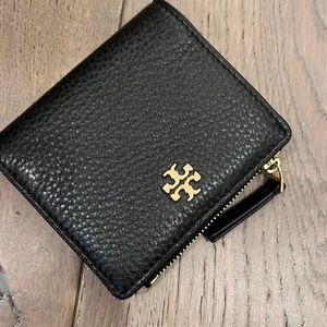 Black and gold Tory Burch wallet.